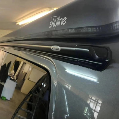 Roof rack system on a vehicle with 'skyline' branding